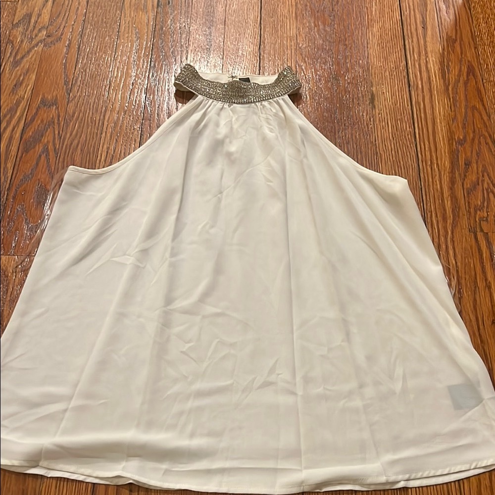Elegant White Top with Silver Accents